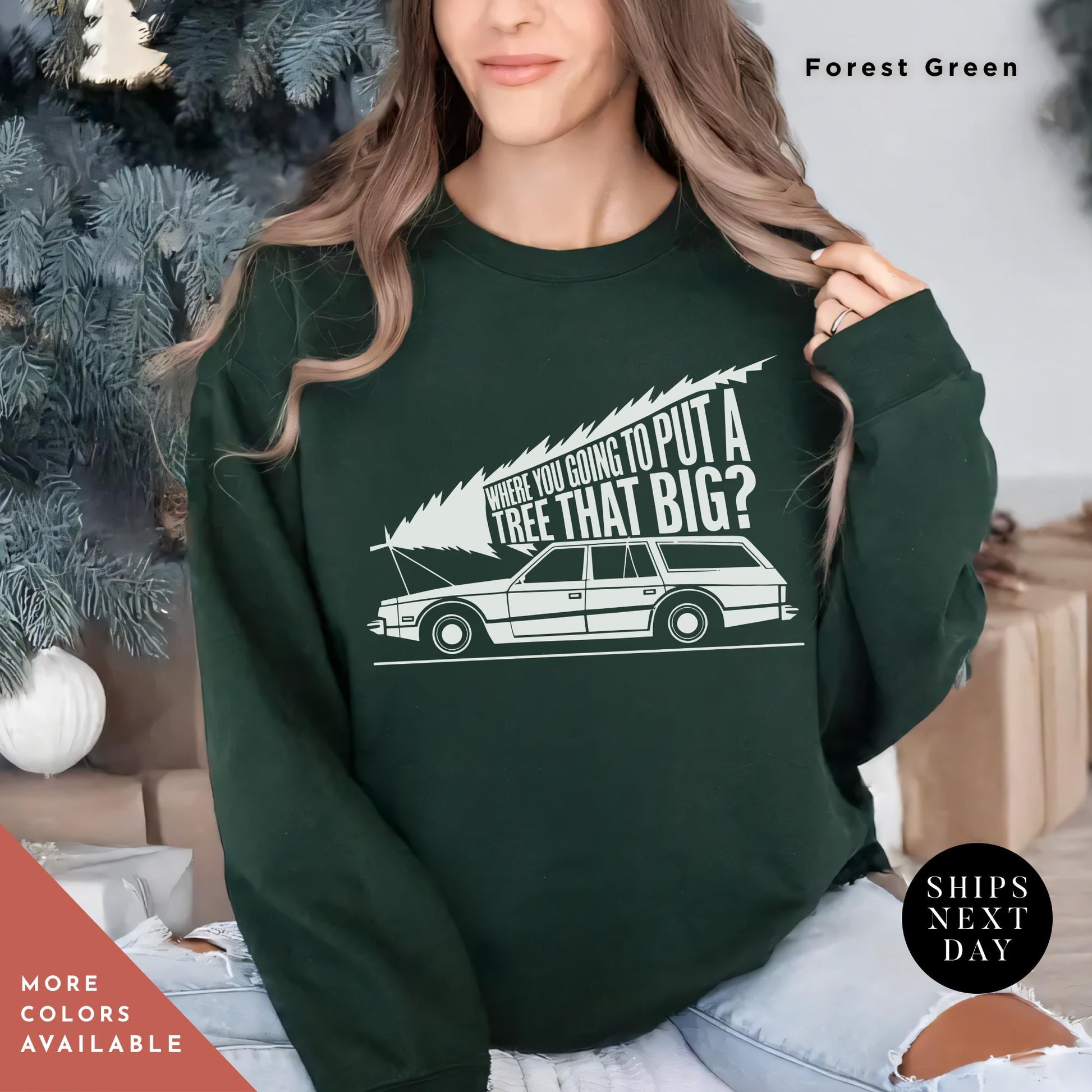 a woman wearing a green sweatshirt with a white car on it, You&#39;Re Gonna Put A Tree That Big Unisex Sweatshirts, Funny Christmas Gift, Griswold Sweatshirt, Christmas Sweatshirts for Christmas Vacation
