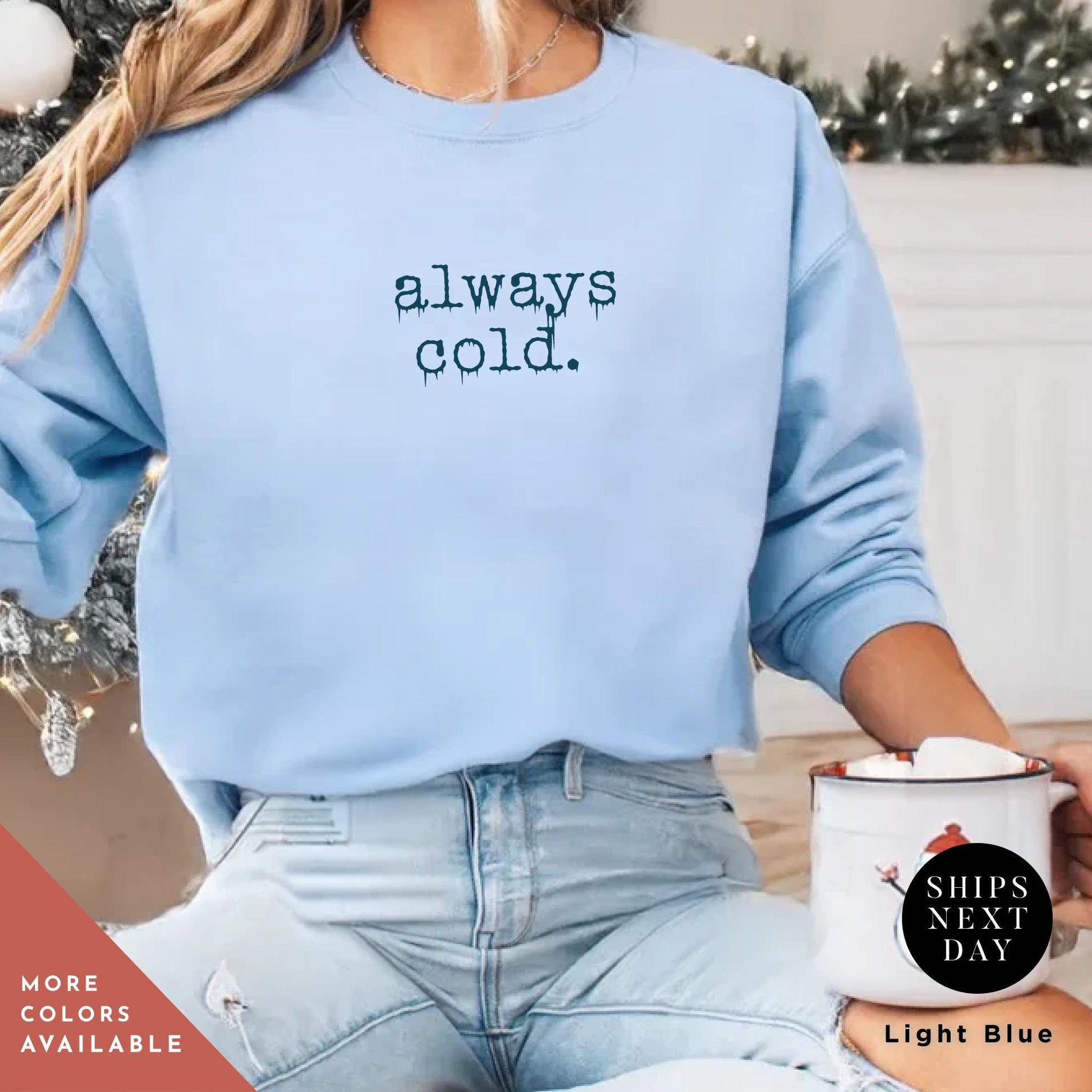 a woman sitting on the floor holding a cup of coffee, Always Cold Sweatshirt, Funny Cold Winter Sweatshirt, womens winter gift, cute fall gift, christmas gift, winter graphic Holiday Sweatshirt