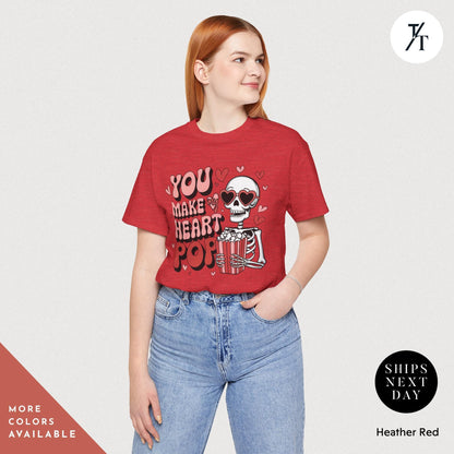 Woman wearing a shirt with a skeleton holding popcorn that says You Make My Heart Pop, Shirt Funny Skeleton Valentines Gift For Her, Retro Valentines Day Skeleton shirt, Heart Pops For You Valentine tee