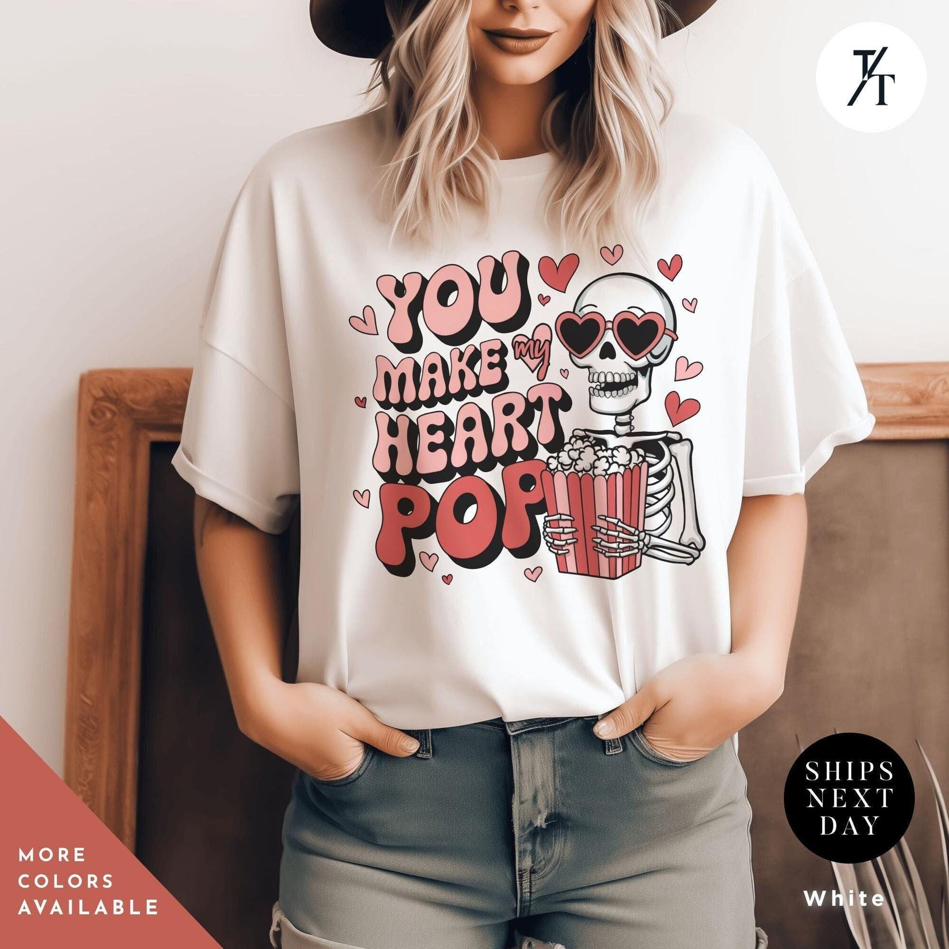 Woman wearing a shirt with a skeleton holding popcorn that says You Make My Heart Pop, Shirt Funny Skeleton Valentines Gift For Her, Retro Valentines Day Skeleton shirt, Heart Pops For You Valentine tee