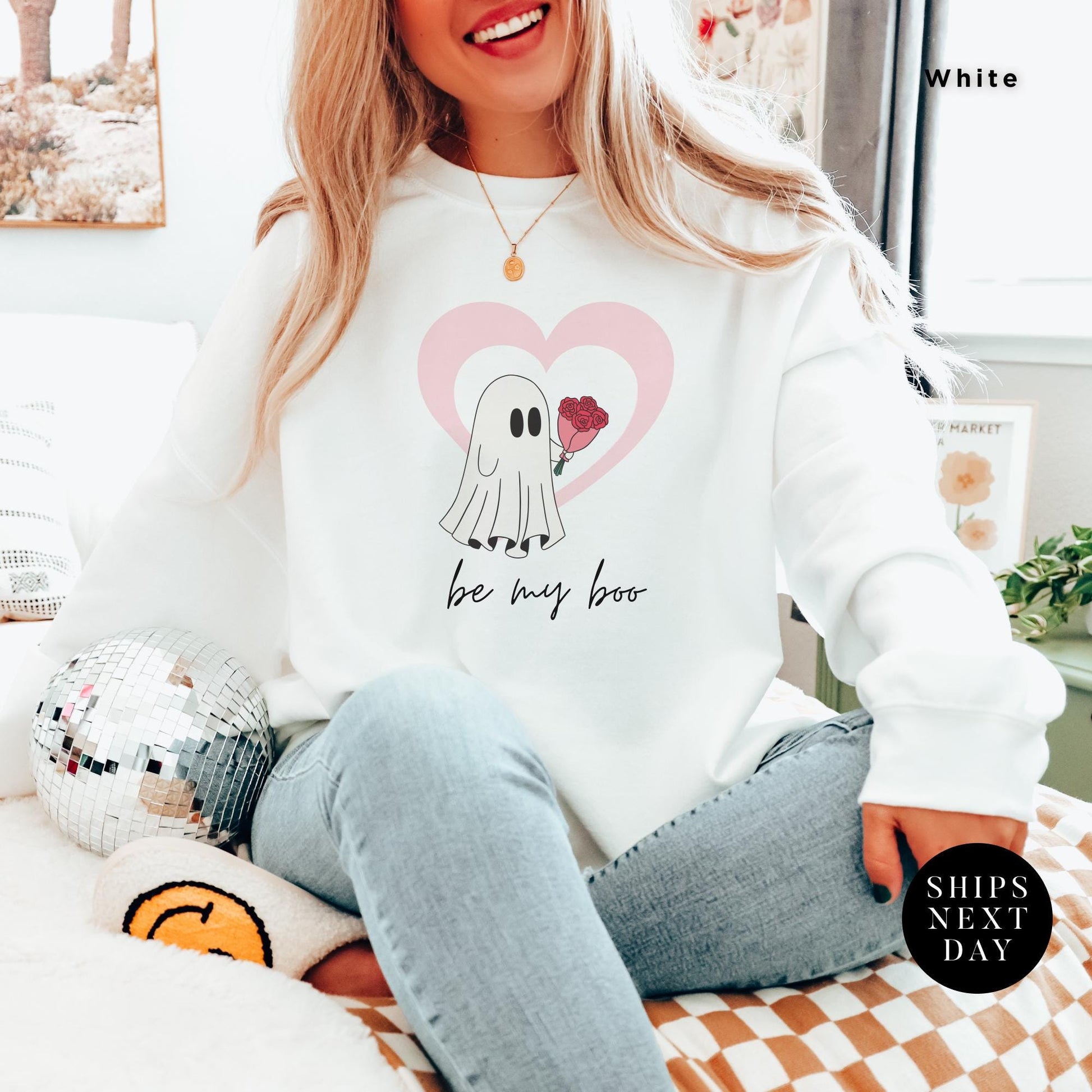 a woman wearing a white sweatshirt with a picture ghost with roses that says Be My Boo Sweatshirt, ghost sweater, valentines day hoodie, Valentine Sweatshirt, Heart Sweatshirts, Ghost Sweater, Be Mine Sweatshirts Xoxo