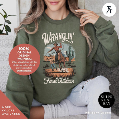 wranglin feral kids sweatshirt, Gift For Mom, Feral Mom Sweatshirt, Western Raccoon Cowboy sweater, Funny Parenting Humor Mother&#39;S Day Gift