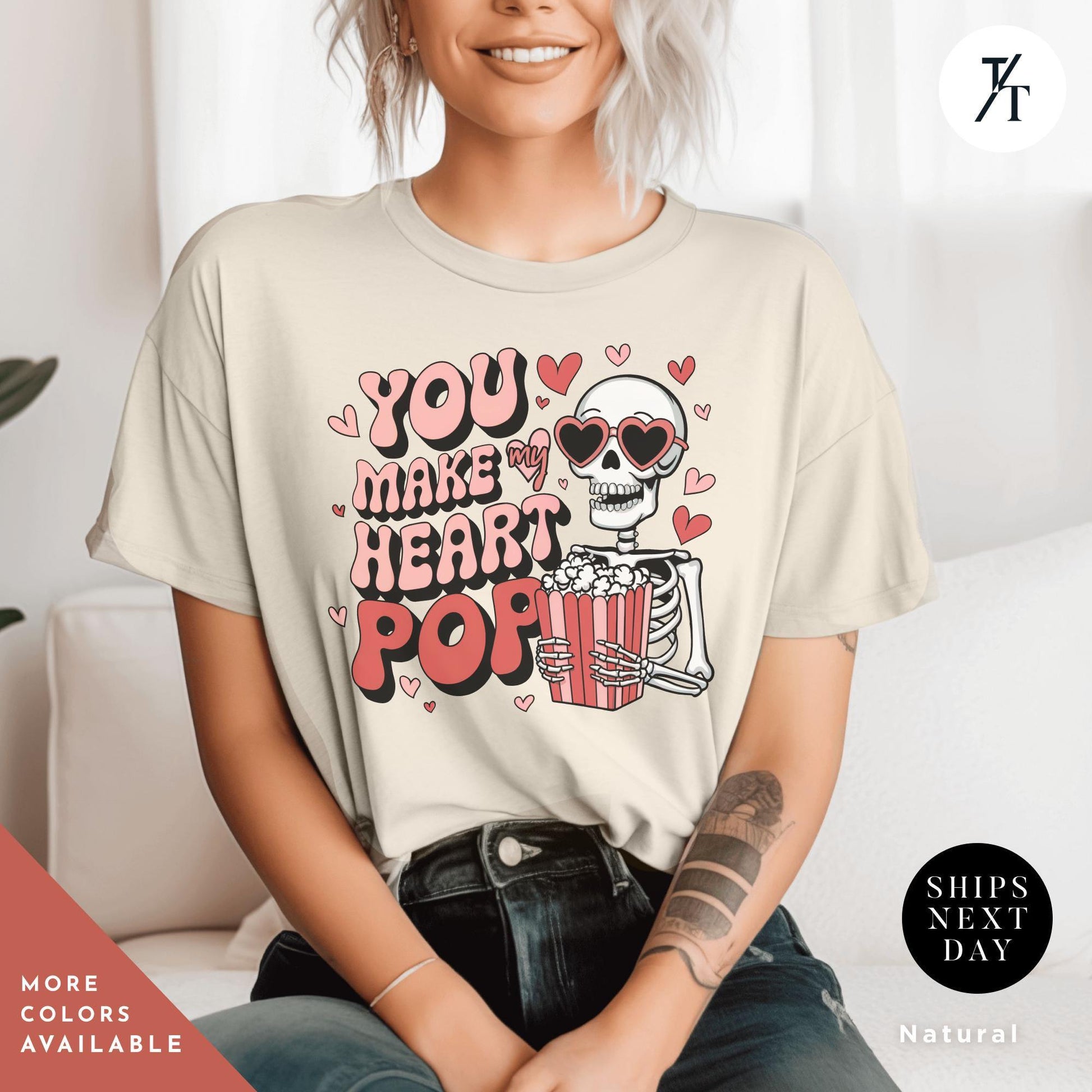 Woman wearing a shirt with a skeleton holding popcorn that says You Make My Heart Pop, Shirt Funny Skeleton Valentines Gift For Her, Retro Valentines Day Skeleton shirt, Heart Pops For You Valentine tee