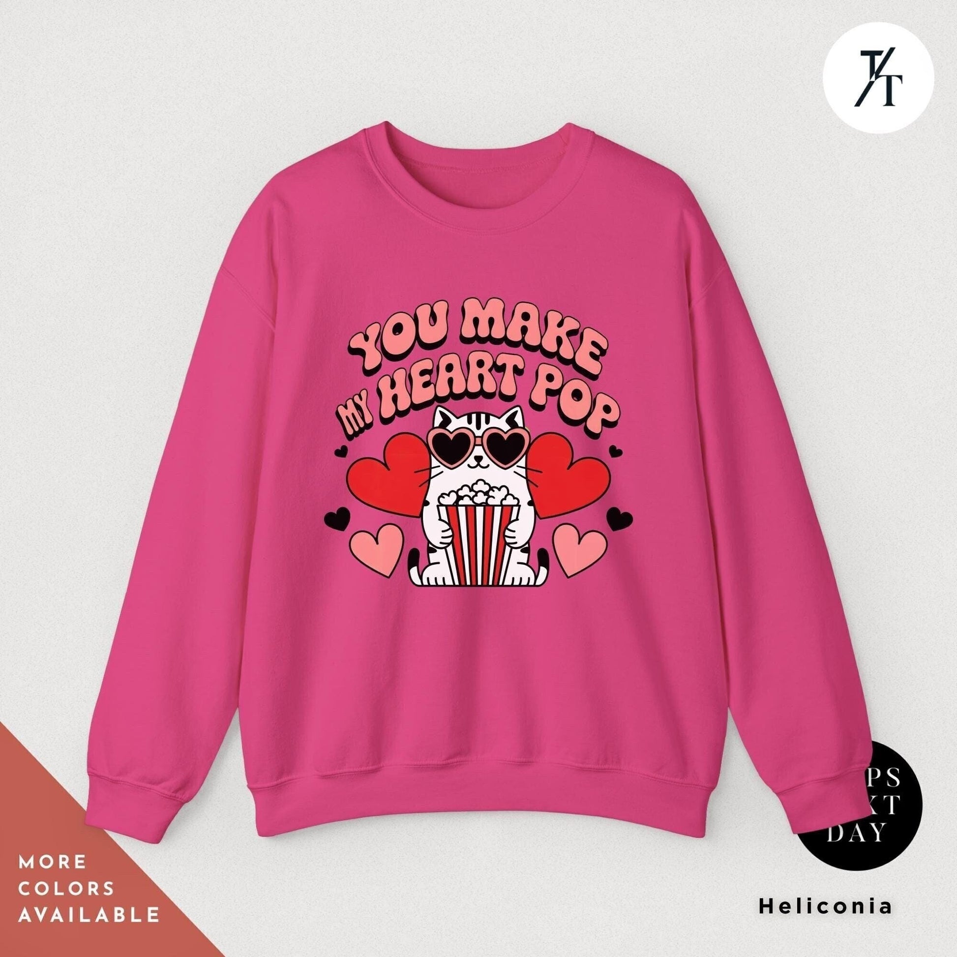 a pink sweatshirt that says you make my heart pop