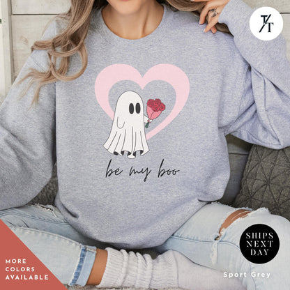 a woman wearing a grey sweatshirt with a picture ghost with roses that says Be My Boo Sweatshirt, ghost sweater, valentines day hoodie, Valentine Sweatshirt, Heart Sweatshirts, Ghost Sweater, Be Mine Sweatshirts Xoxo